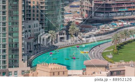 Lake with boats near park in Dubai downtown aerial top view from above timelapse Lake with boats near park in Dubai downtown aerial top view from above timelapse 88952120