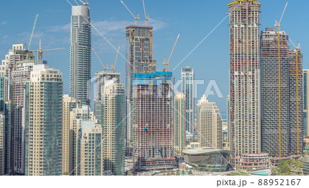 Futuristic aerial cityscape timelapse with modern architecture of Dubai downtown, United Arab Emirates. Futuristic aerial cityscape timelapse with modern architecture of Dubai downtown, United Arab Emirates. 88952167