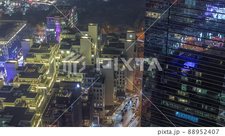 Hotels and office buildings in financial district in Dubai aerial night timelapse 88952407