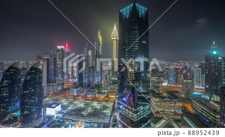 Panorama of futuristic skyscrapers in financial district business center in Dubai night timelapse 88952439
