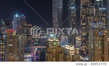 Skyscrapers of Dubai Marina near intersection on Sheikh Zayed Road with highest residential buildings night timelapse Skyscrapers of Dubai Marina near intersection on Sheikh Zayed Road with highest residential buildings night timelapse 88952479