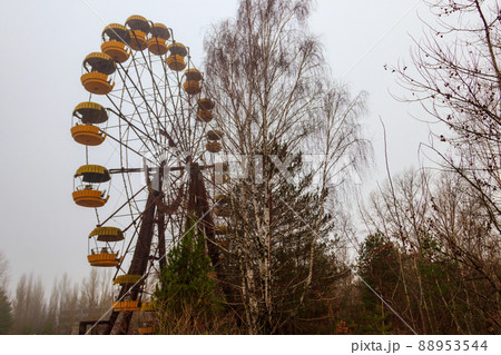 Abandoned Ferris Wheel in the amusement park of ghost town Pripyat in Chernobyl Exclusion Zone, Ukraine 88953544