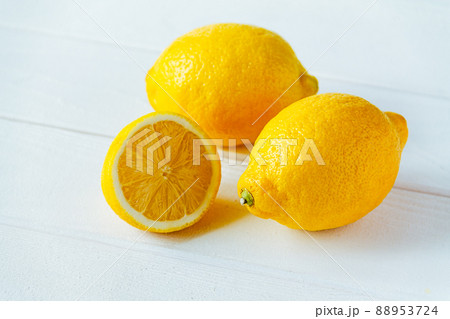 fresh sliced lemon on white wooden natural background fresh sliced lemon on white wooden natural background 88953724