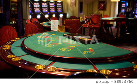 An empty blackjack table in a casino in green tones 88953760