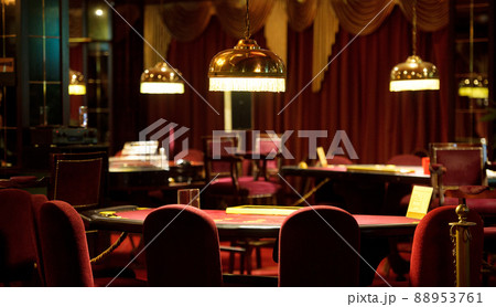 An empty blackjack table in a casino in red tones 88953761