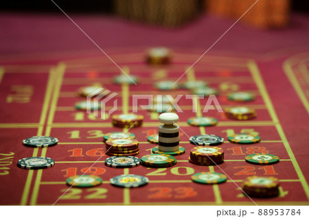 close-up of chips on the gaming table in a roulette casino close-up of chips on the gaming table in a roulette casino 88953784