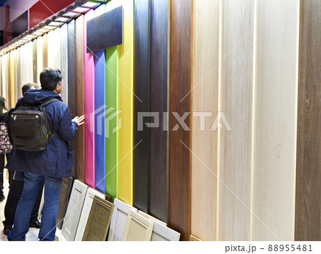 Buyers in construction shop in department of wooden color panels 88955481