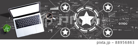 Rating star concept with a laptop computer Rating star concept with a laptop computer 88956863