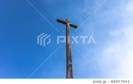 Crucifixion of Jesus Christ against the blue sky. 88957641