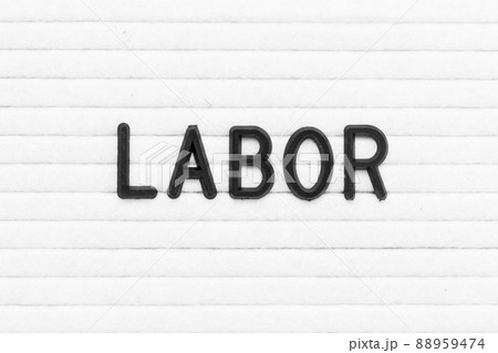 Black color letter in word labor on white felt board background 88959474