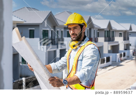 Engineer working on construction building site,Architects discussing project of building outdoors. 88959637
