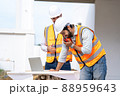 Engineer working on construction building site,Architects discussing project of building outdoors. 88959643