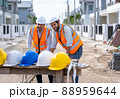 Team engineer and architects are meeting to plan for new project measuring layout. 88959644