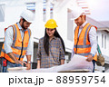 Engineer foreman discussion work control to building construction working in site. 88959754