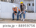 Engineer and architect are stressed at construction site,He is having problems in work. 88959756