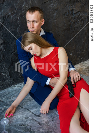 young guy sits on floor and hugs girl young guy sits on floor and hugs girl 88961331
