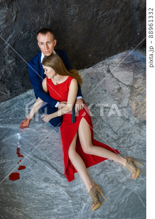young guy sits on floor and hugs girl young guy sits on floor and hugs girl 88961332