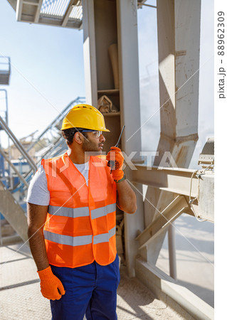 Construction industrial engineer with walkie-talkie at plant Construction industrial engineer with walkie-talkie at plant 88962309