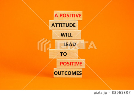 Think positive symbol. Wood blocks with words A positive attitude will come to positive outcomes. Beautiful orange background copy space. Business motivational think positive concept. 88965307