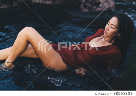 Graceful lady chilling in water 88965308