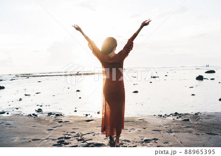 Unrecognizable woman with hands up 88965395