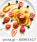 Pancakes decorated with berries, strawberries, raspberries, blueberries and sauce 88965427