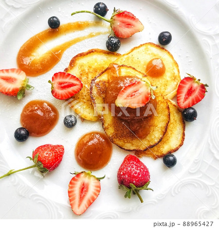 Pancakes decorated with berries, strawberries, raspberries, blueberries and sauce 88965427