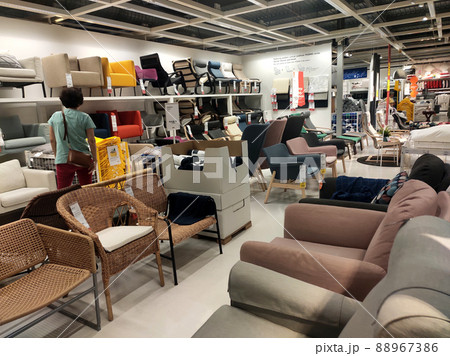 SELANGOR, MALAYSIA - JULY 4, 2022: Sofa furniture and chairs in the IKEA showroom in Malaysia. The furniture is well arranged to make it easy for customers to see and inspect it before buying. 88967386