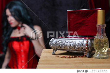 Jewelry Box with Woman in Corset in background, Shallow DOF, Focus on Jewelry Box 88973772