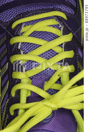 Purple and Yellow Athletic Shoe Close up 88973795