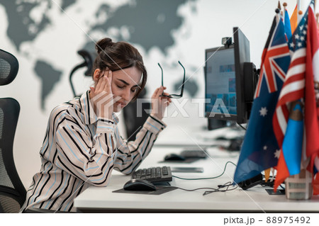 Beautiful Shocked and Annoyed Young Woman Looking her Laptop. Sad Operator Agent Woman Working from Home in a Call Center 88975492