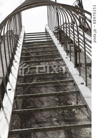 Metal ladder on an industrial building Metal ladder on an industrial building 88976353
