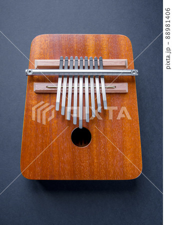 Traditional wooden kalimba isolated on black Traditional wooden kalimba isolated on black 88981406