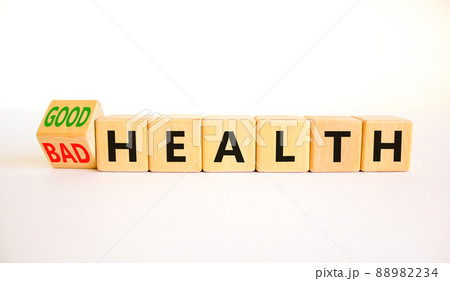 Good or bad health symbol. Turned wooden cubes and changed concept words Bad health to Good health. Beautiful white table white background, copy space. Medical good or bad health concept. Good or bad health symbol. Turned wooden cubes and changed concept words Bad health to Good health. Beautiful white table white background, copy space. Medical good or bad health concept. 88982234