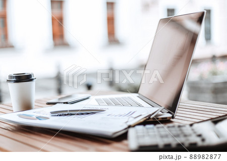 close up. table with financial charts on the terrace in the cafe 88982877