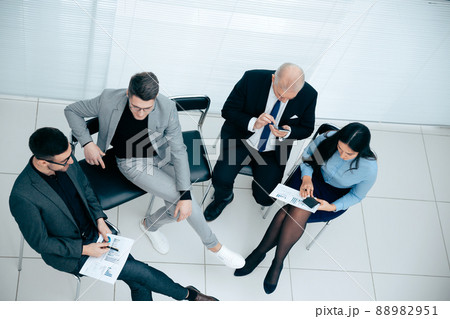 top view. businessman using a smartphone during a work meeting top view. businessman using a smartphone during a work meeting 88982951