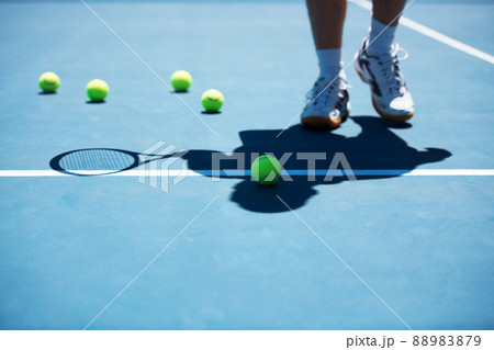 Practice makes perfect. Shot of a man unidentified man standing on a tennis court. 88983879
