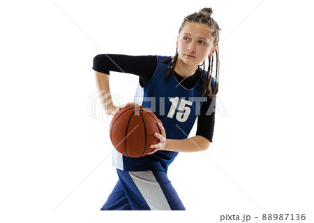 Portrait of teen girl in motion, basketbal player training isolated over white studio background Portrait of teen girl in motion, basketbal player training isolated over white studio background 88987136