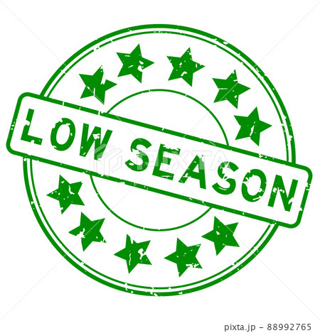 Grunge green low season word with star icon round rubber seal stamp on white background 88992765