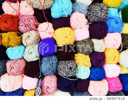 multicolored woolen threads in a ball for knitting close up, the concept of sewing, knitting and needlework 88997918
