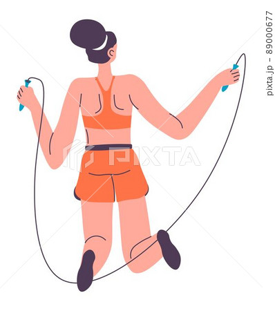 Woman in sportswear practicing on jumping rope 89000677
