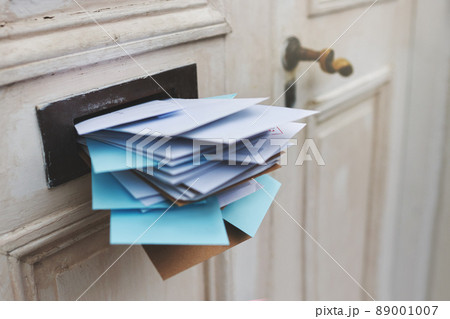 Jam-packed with the post. Cropped shot of letters in a letter box. Jam-packed with the post. Cropped shot of letters in a letter box. 89001007