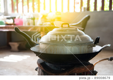 Thai traditional steamer on pan and charcoal stove 89008679