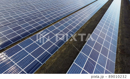 Aerial drone view solar panels on sunny day close-up. Photovoltaic solar panel Aerial drone view solar panels on sunny day close-up. Photovoltaic solar panel 89010232