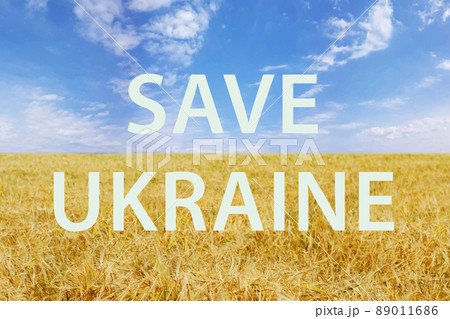 Wheat field, colors of Ukrainian flag with Save Ukraine inscription Wheat field, colors of Ukrainian flag with Save Ukraine inscription 89011686