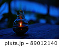 Lantern Lighting up the Dark on a Wooden Table and with a Dark Background, Warm Reflecting light 89012140