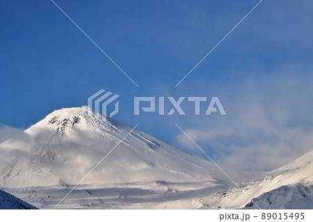 Mountain landscape at dawn. Peak of mountains over white thick clouds. Mountain landscape at dawn. Peak of mountains over white thick clouds. 89015495