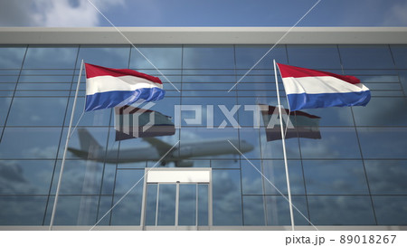 Waving flags of the Netherlands in the airport and landing airplane. 3D rendering Waving flags of the Netherlands in the airport and landing airplane. 3D rendering 89018267