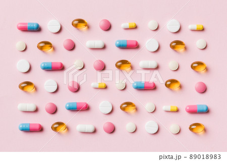 Many different pills and space for text on colorful background, top view. Different pills on color background, flat lay Many different pills and space for text on colorful background, top view. Different pills on color background, flat lay 89018983