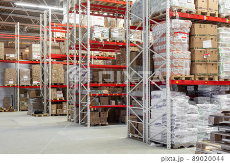 large warehouse with aluminum shelving system and cardboard boxes 89020044